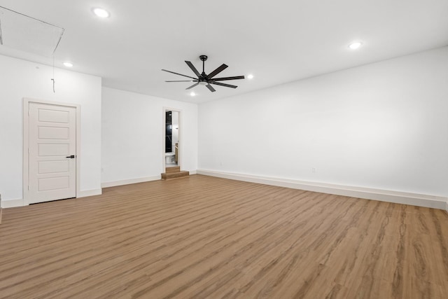 unfurnished room with ceiling fan and light hardwood / wood-style floors