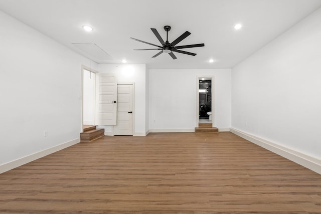 empty room featuring hardwood / wood-style floors and ceiling fan