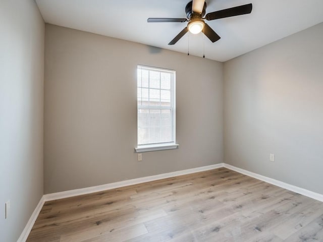 spare room featuring ceiling fan and light hardwood / wood-style flooring