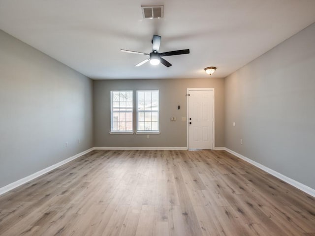 unfurnished room with ceiling fan and light wood-type flooring