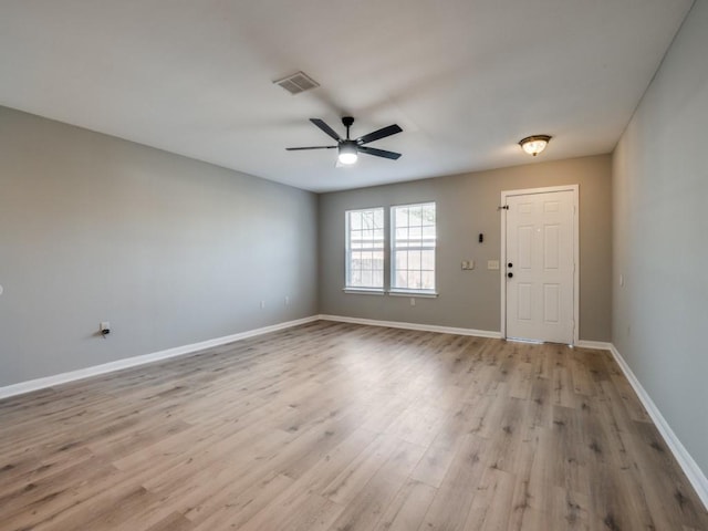 foyer entrance with light hardwood / wood-style floors and ceiling fan