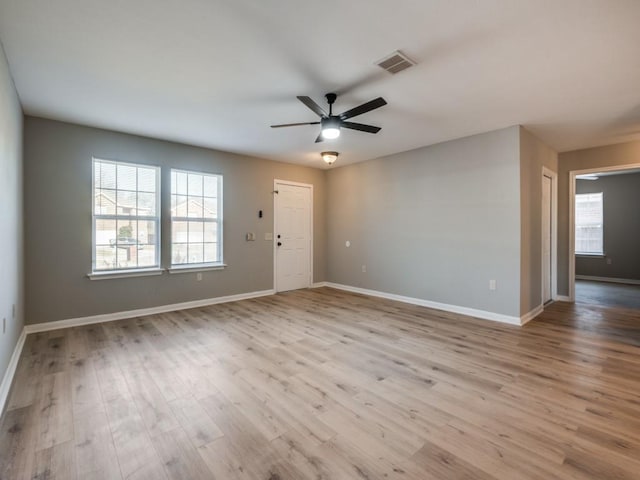 unfurnished room featuring ceiling fan and light wood-type flooring