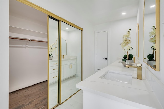 bathroom featuring vanity and hardwood / wood-style floors