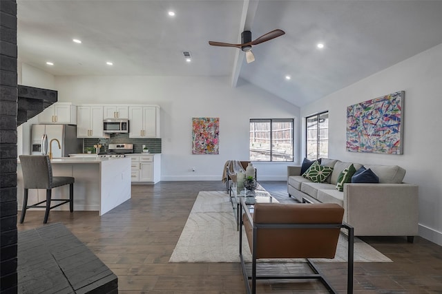 living room featuring beamed ceiling, ceiling fan, high vaulted ceiling, and dark wood-type flooring