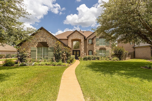 french country home with a front yard