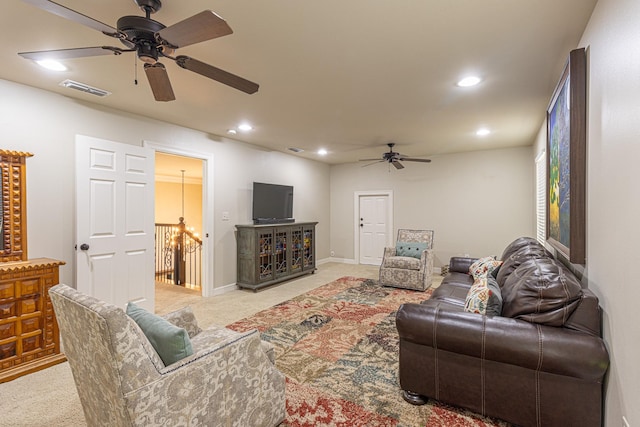 living room with light colored carpet and ceiling fan