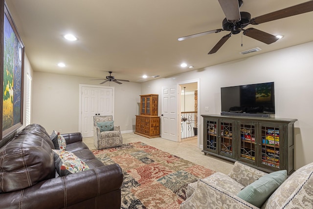 living room with light carpet and ceiling fan