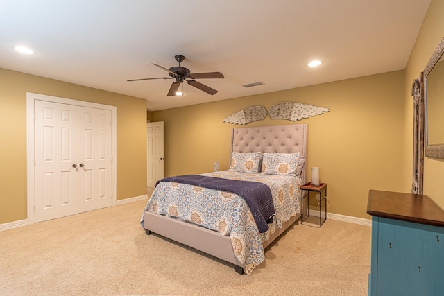 bedroom with carpet floors, ceiling fan, and a closet