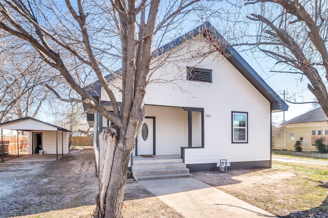 bungalow-style home with a carport