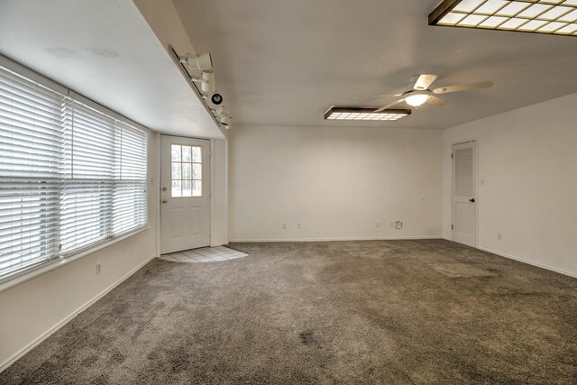 spare room featuring ceiling fan, carpet floors, and a textured ceiling