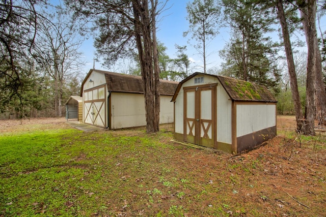 view of outdoor structure with a lawn