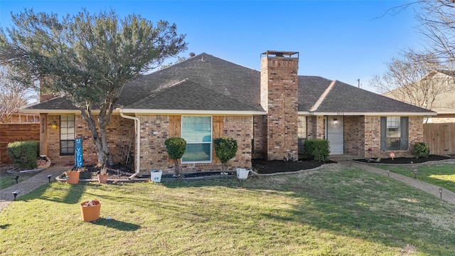 ranch-style home with a front lawn