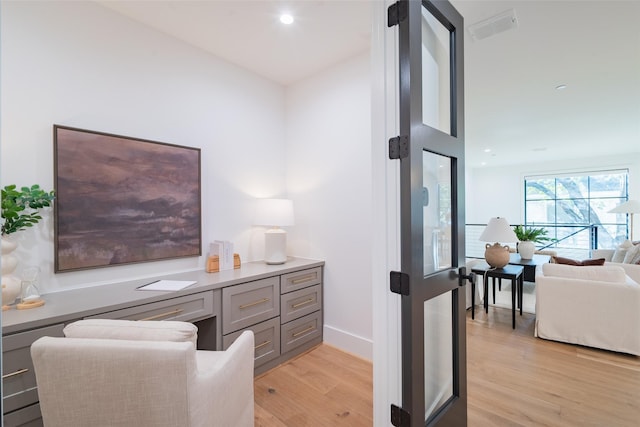 home office with light wood-type flooring