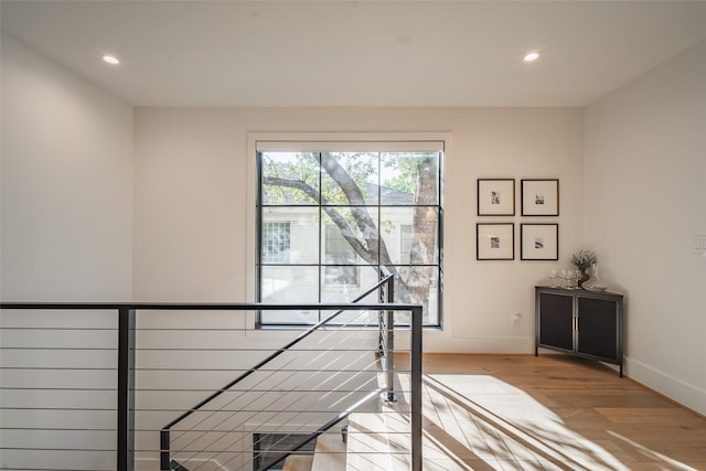 stairway featuring wood-type flooring