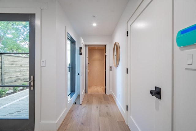 corridor featuring light wood-type flooring