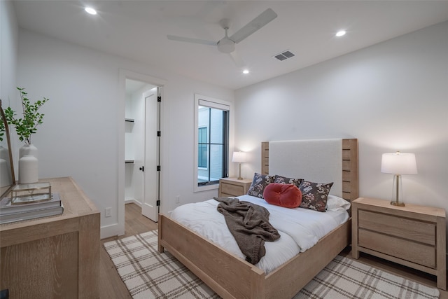 bedroom featuring ceiling fan and light wood-type flooring