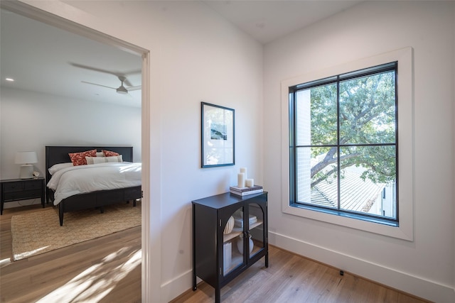 bedroom featuring ceiling fan and light hardwood / wood-style floors