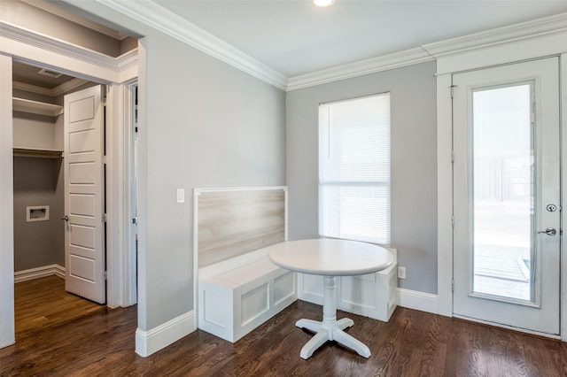 unfurnished office featuring ornamental molding and dark hardwood / wood-style flooring