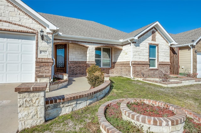 doorway to property featuring a garage and a lawn