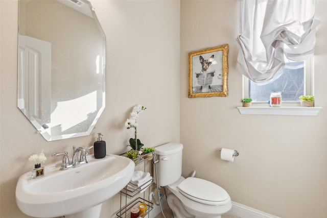 bathroom featuring sink and toilet