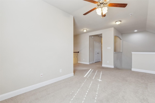 carpeted spare room with ceiling fan