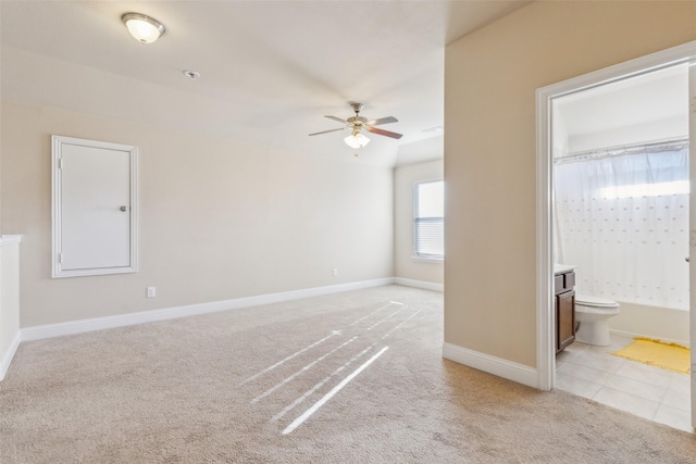 empty room featuring light colored carpet and ceiling fan