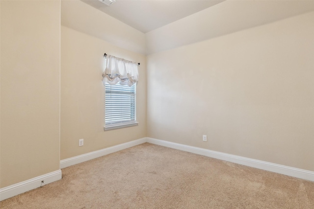 empty room with light colored carpet