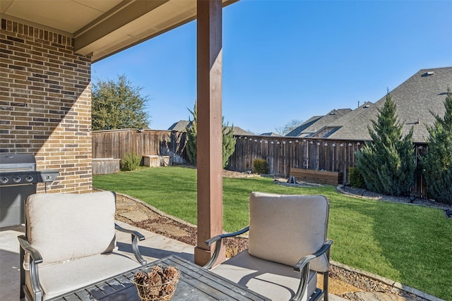 view of patio featuring a grill