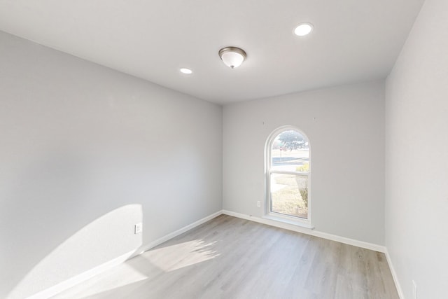 spare room with light hardwood / wood-style flooring