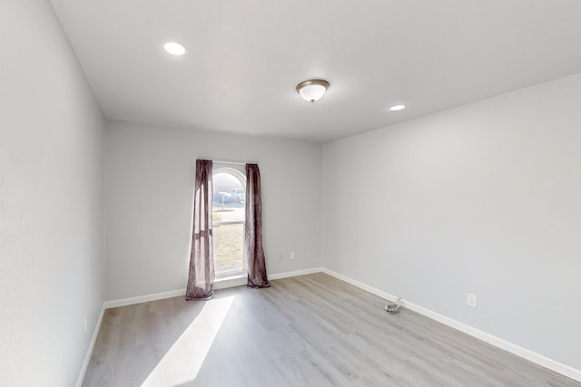 unfurnished room featuring light hardwood / wood-style flooring