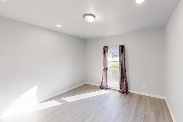 unfurnished room featuring light hardwood / wood-style flooring