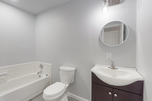 bathroom featuring vanity, toilet, and a bathtub