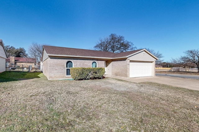 ranch-style house with a garage and a front lawn