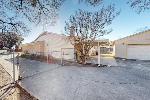 view of side of home featuring a garage