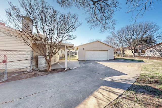 view of side of property with an outbuilding and a garage