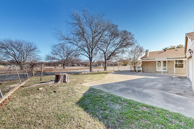 view of yard featuring a rural view and a patio