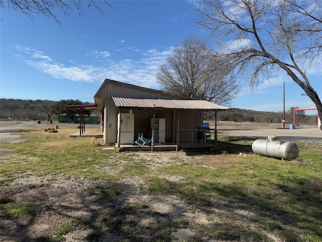 exterior space with a yard and a rural view