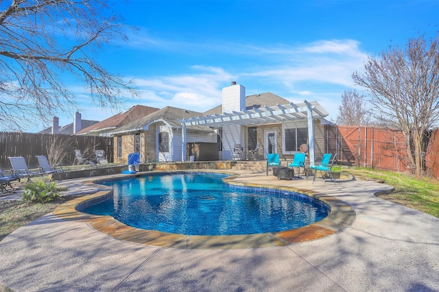 view of swimming pool featuring a patio area and a pergola