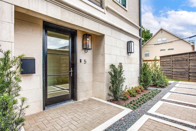 property entrance featuring a patio area