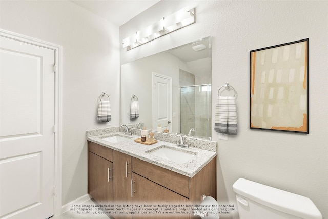 bathroom with vanity, toilet, and an enclosed shower