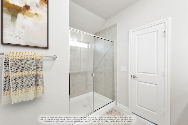 bathroom with an enclosed shower, tile patterned flooring, and lofted ceiling