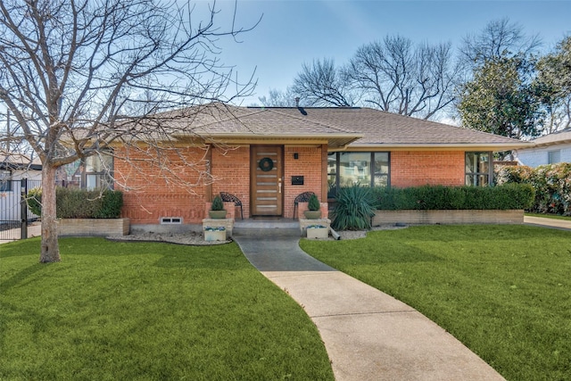 single story home featuring a front lawn