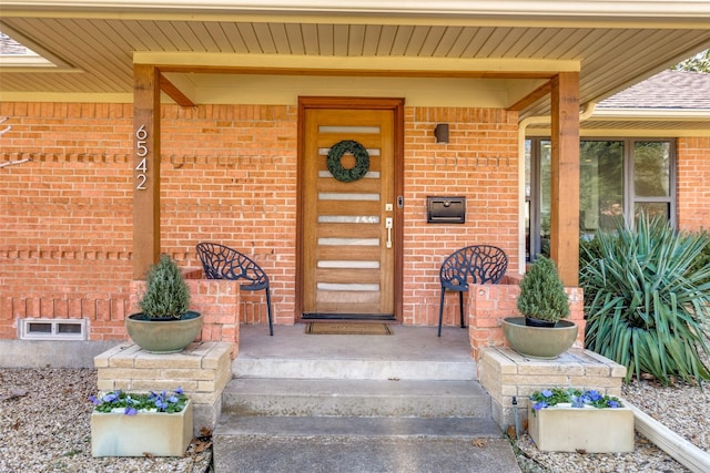 property entrance featuring a porch