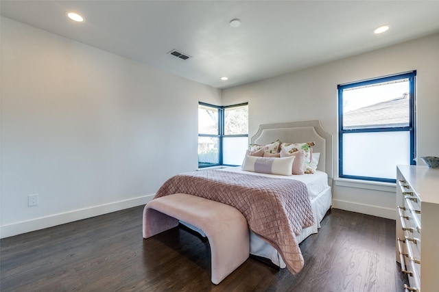 bedroom with dark wood-type flooring