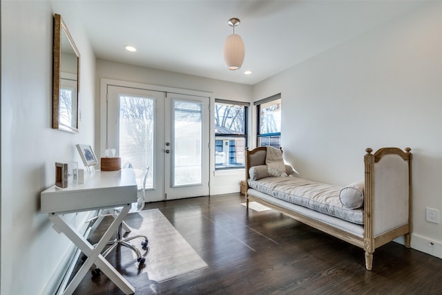 bedroom featuring dark wood-type flooring, access to outside, and french doors