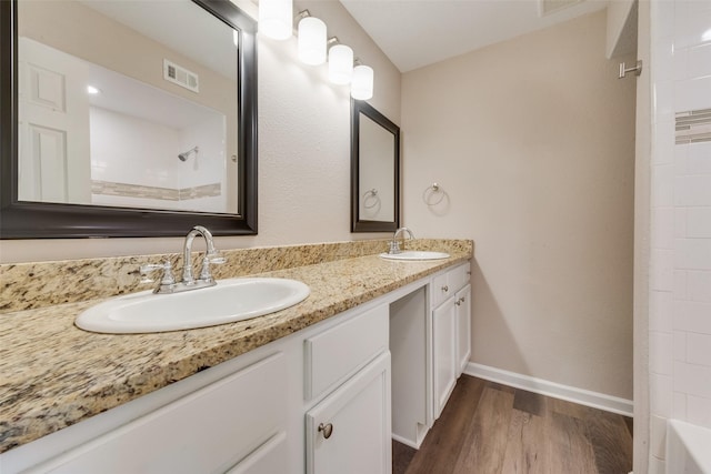 bathroom featuring vanity and hardwood / wood-style floors