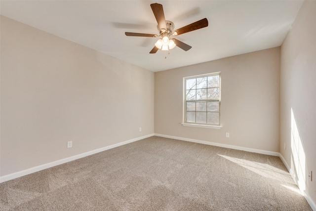 unfurnished room with carpet and ceiling fan