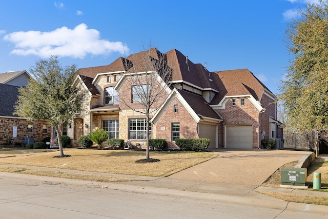 view of front facade featuring cooling unit and a garage