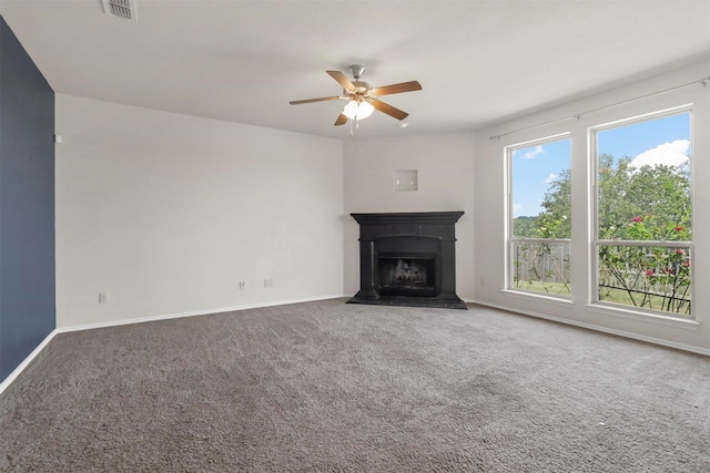 unfurnished living room with ceiling fan and carpet floors