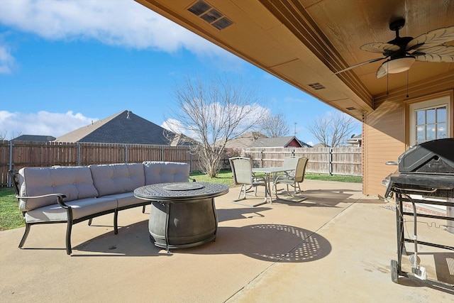 view of patio / terrace with a grill, an outdoor living space with a fire pit, and ceiling fan